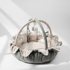 Lumee Novi baby play gym with ruffled edges on a white background