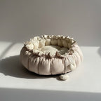 Padded baby play mat with ruffled edges in cocoon style